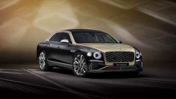 Front three quarter of the new hybrid Bentley Flying Spur Mulliner in a Duo Tone extertior featuring 21 inch directional and diamond cut wheels